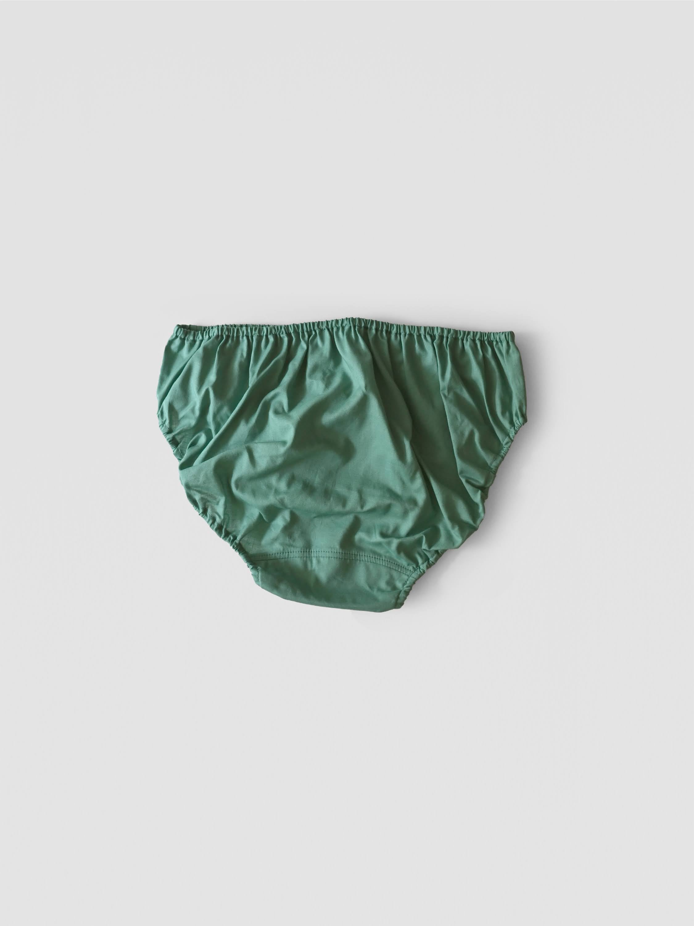 NO.22 EMERALD PANTS 深い森の奥、光を浴びて輝く木々の葉。 – TESHIKI
